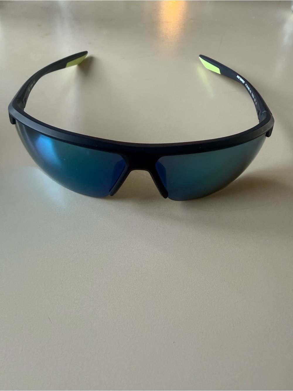 Nike Black Frame Sunglasses with Blue Mirrored Lenses and Yellow Temple Accents